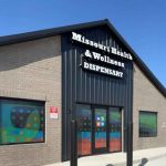 Exterior of Kirksville cannabis dispensary storefront with signage and entrance doors