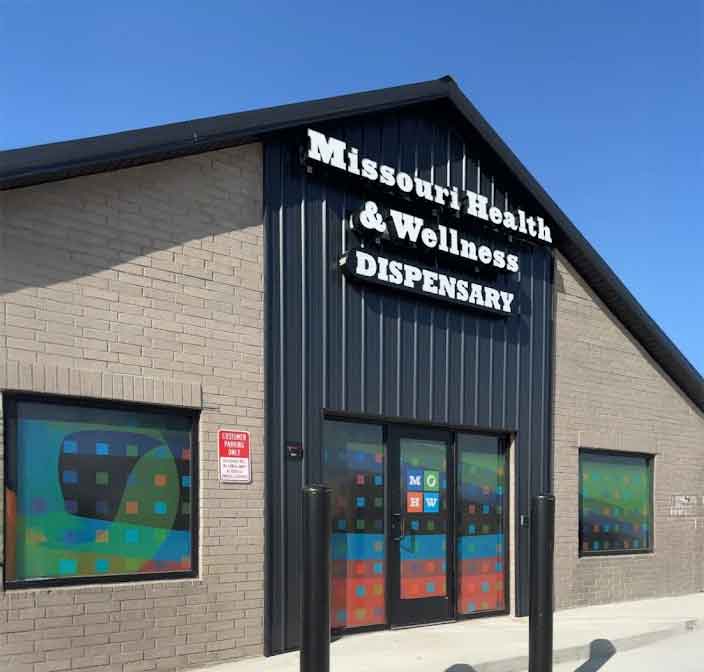 Exterior of Kirksville cannabis dispensary storefront with signage and entrance doors