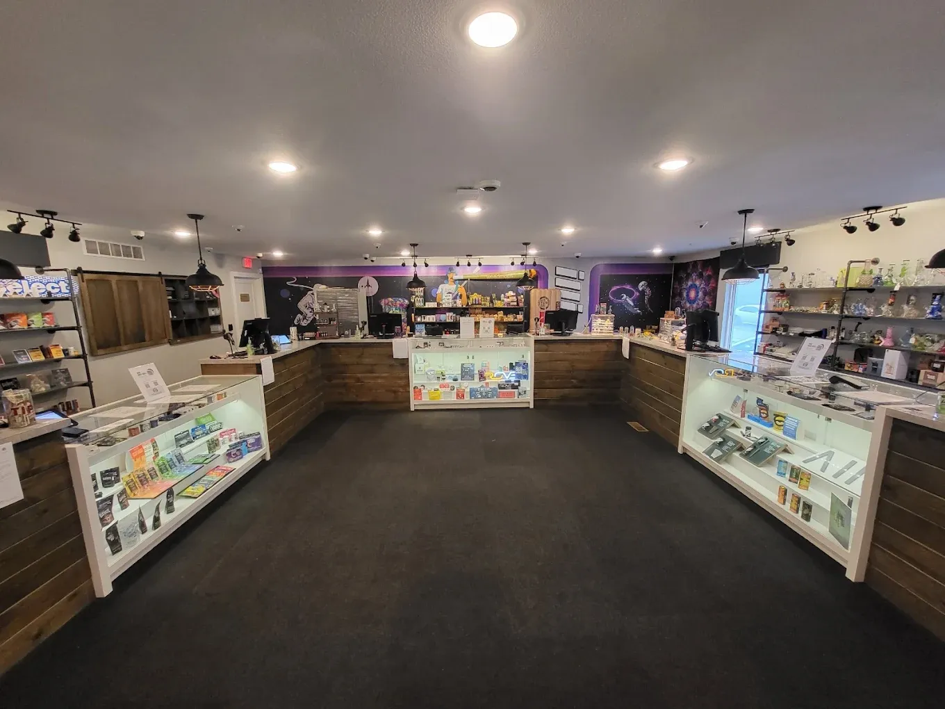 # Alt Text

Interior of cannabis dispensary with product displays, counters, and ceiling lighting